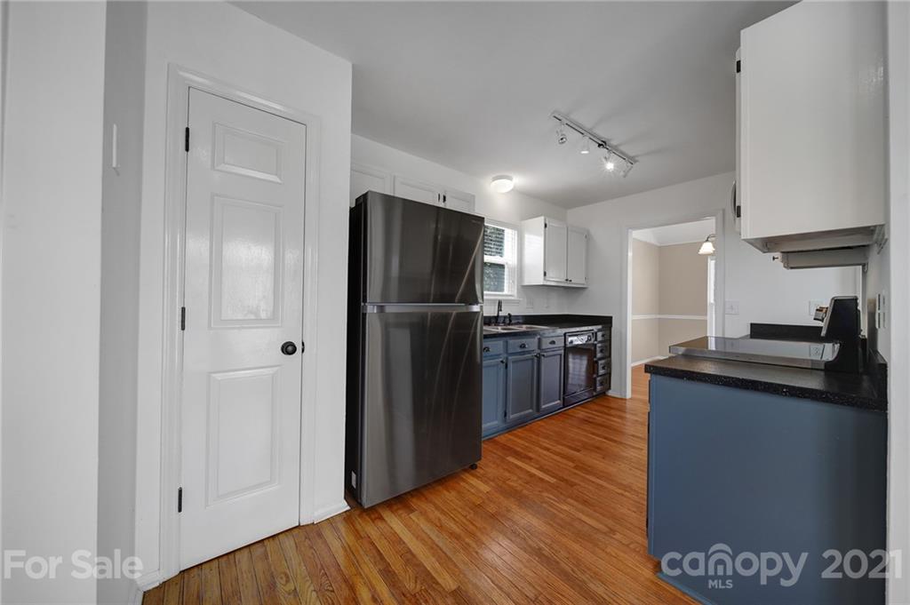 7032 Cambridge Circle Tega Cay, SC 29708 - Photo 15 of 36 a kitchen with stainless steel appliances granite countertop a refrigerator and a sink