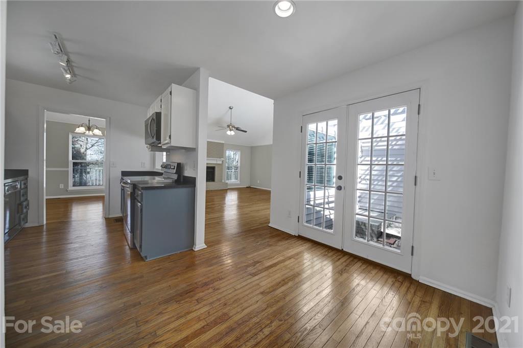 7032 Cambridge Circle Tega Cay, SC 29708 - Photo 16 of 36 a view of a kitchen with wooden floor