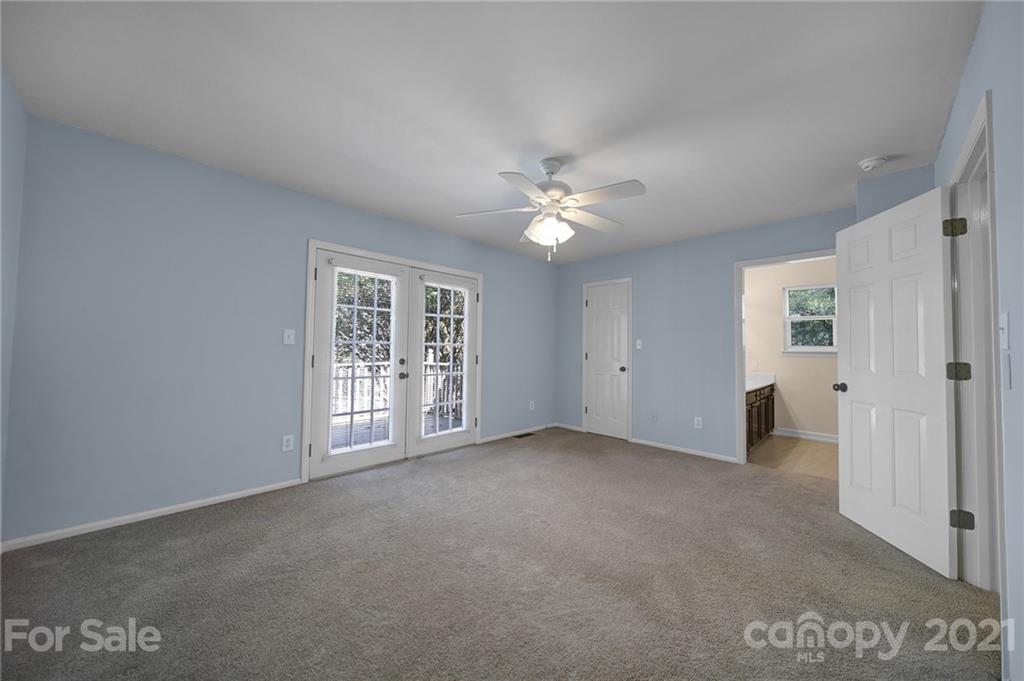 7032 Cambridge Circle Tega Cay, SC 29708 - Photo 20 of 36 a view of an empty room with a window