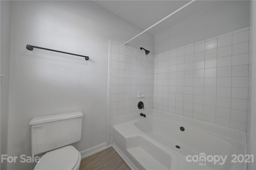 7032 Cambridge Circle Tega Cay, SC 29708 - Photo 22 of 36 a bathroom with a toilet and a bathtub