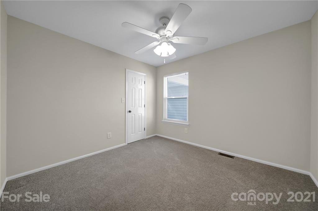 7032 Cambridge Circle Tega Cay, SC 29708 - Photo 25 of 36 a view of an empty room with a window