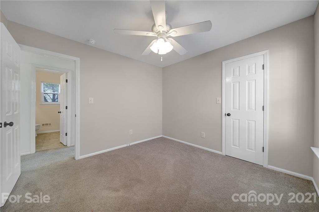 7032 Cambridge Circle Tega Cay, SC 29708 - Photo 26 of 36 an empty room with fan and a ceiling fan