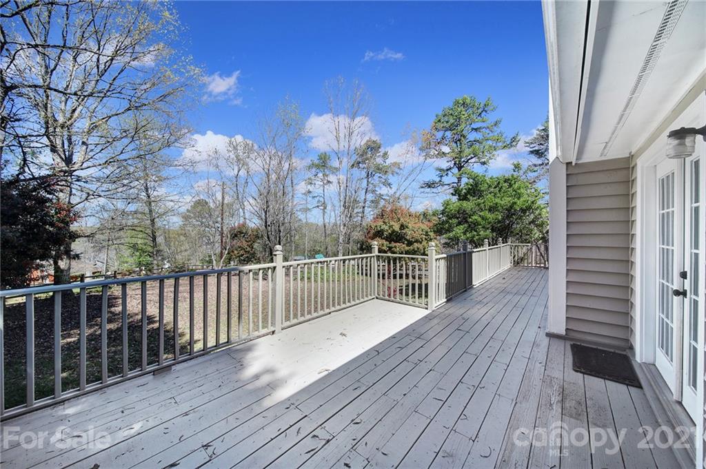 7032 Cambridge Circle Tega Cay, SC 29708 - Photo 29 of 36 a view of a balcony with wooden floor