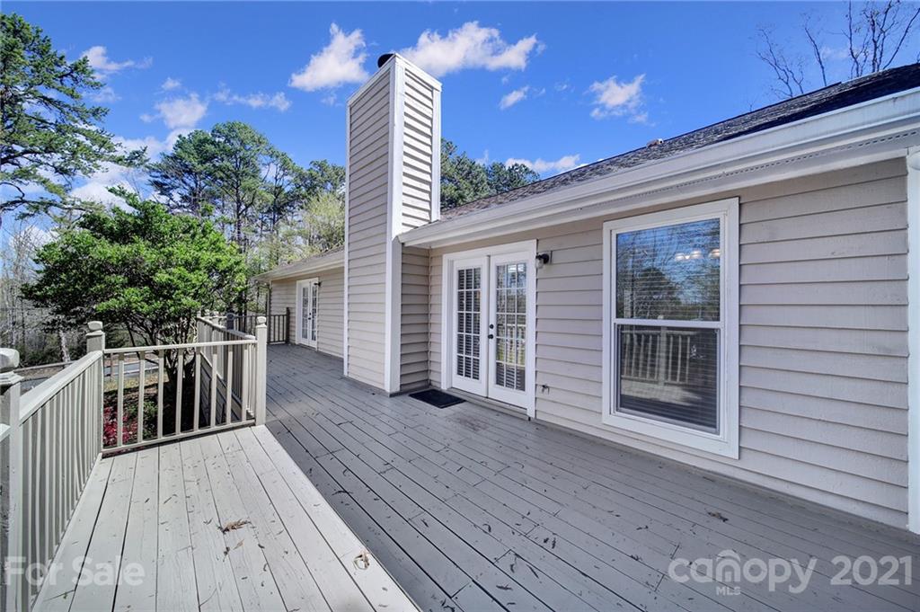 7032 Cambridge Circle Tega Cay, SC 29708 - Photo 30 of 36 a view of a house with deck wooden floor and outdoor space
