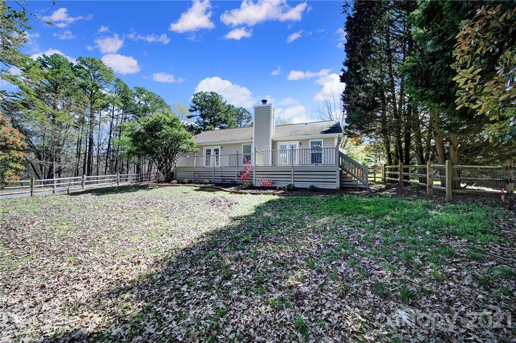 7032 Cambridge Circle Tega Cay, SC 29708 - Photo 32 of 36 a view of house with a yard