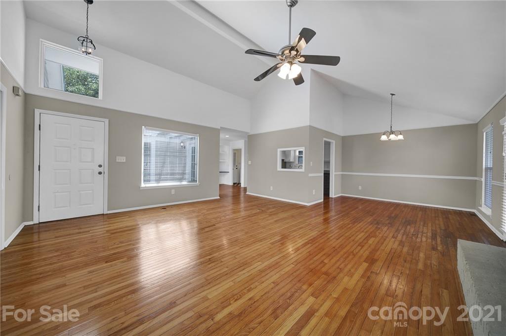 7032 Cambridge Circle Tega Cay, SC 29708 - Photo 5 of 36 a view of empty room with wooden floor and fan