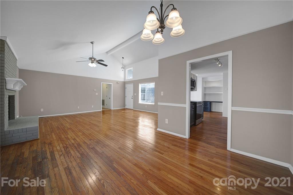 7032 Cambridge Circle Tega Cay, SC 29708 - Photo 10 of 36 a view of empty room with wooden floor