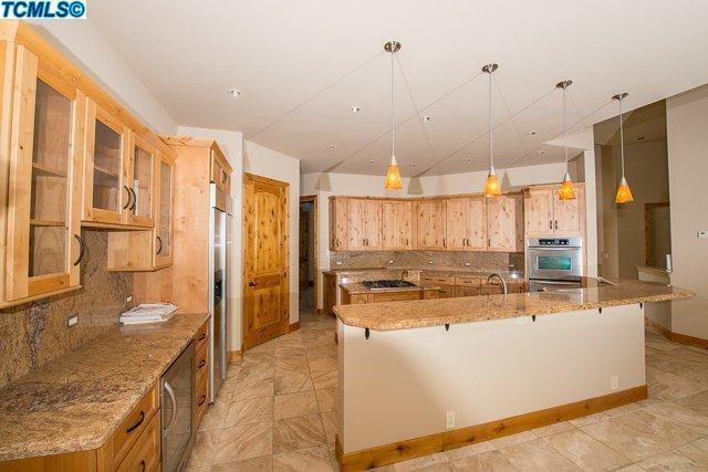 41167 Oak Ridge Drive Three Rivers, CA 93271 - Photo 16 of 27 a large kitchen with kitchen island a large window