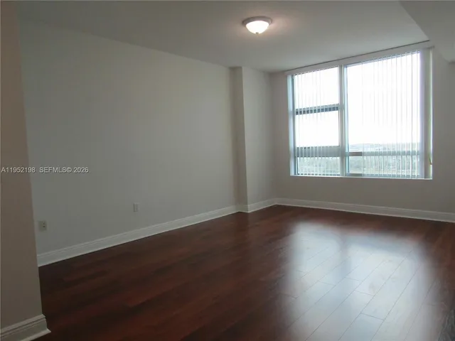 a view of washer and dryer with wooden floor