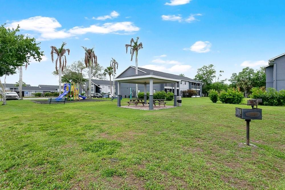 4227 Pershing Pointe Place, Unit 2 Orlando, FL 32822 - Photo 22 of 34 a front view of a house with garden