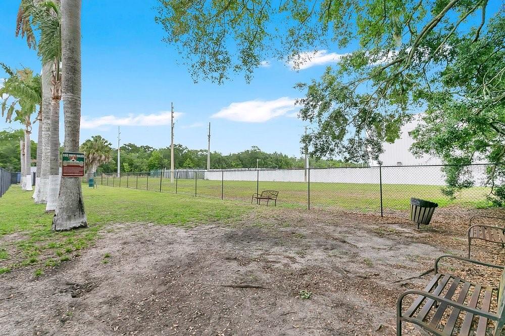 4227 Pershing Pointe Place, Unit 2 Orlando, FL 32822 - Photo 26 of 34 a view of a park with large trees
