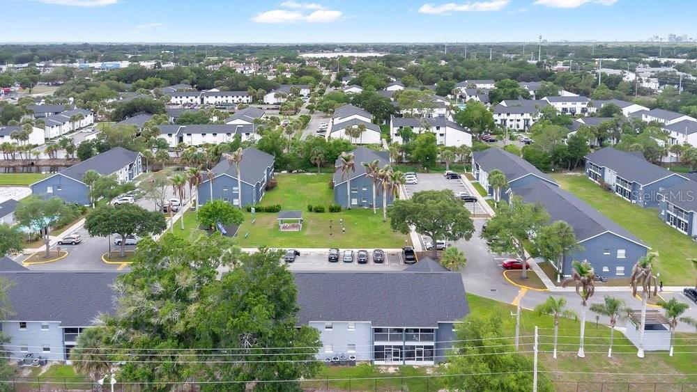 4227 Pershing Pointe Place, Unit 2 Orlando, FL 32822 - Photo 30 of 34 an aerial view of residential houses with outdoor space