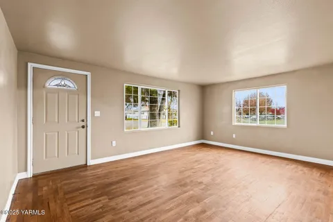 a view of an empty room with a window