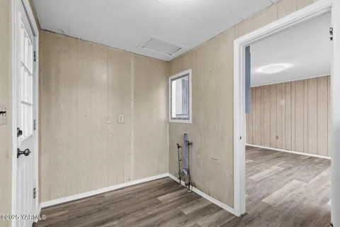 an empty room with wooden floor