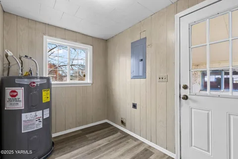 a view of an entryway with wooden floor
