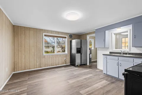a view of a kitchen with a sink and a window