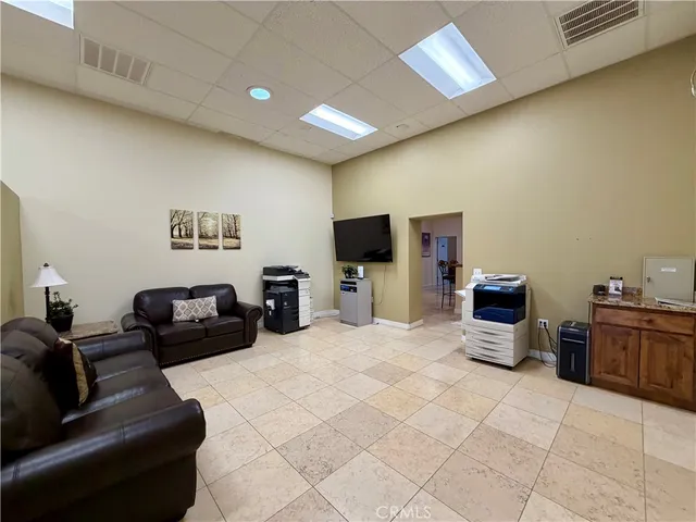 a kitchen with stainless steel appliances kitchen island granite countertop a refrigerator and a stove