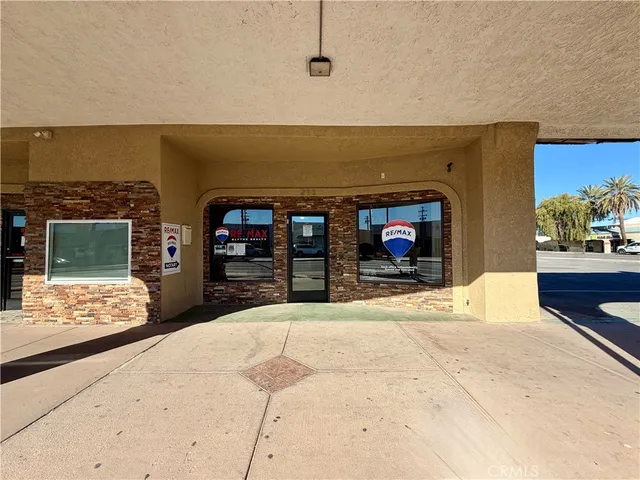a living room with fireplace furniture and a flat screen tv