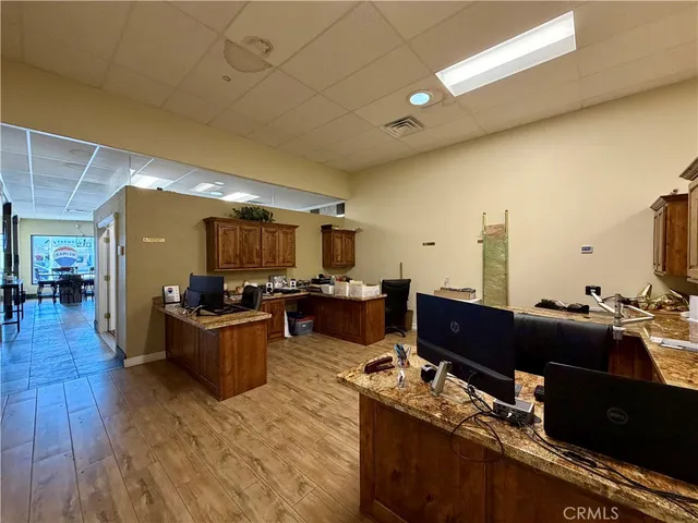 a view of a storage room with water heater and racks