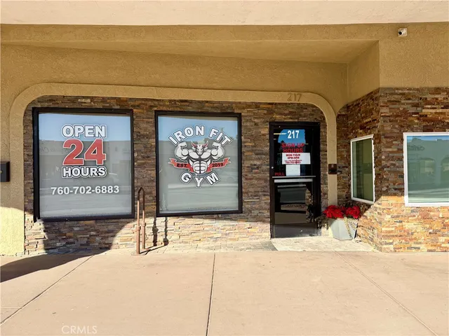 a view of entryway wih livingroom and stairs