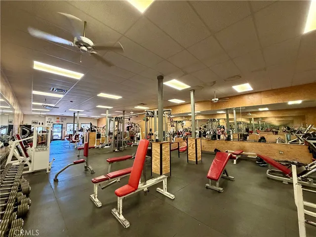 a bathroom with a sink mirror and toilet