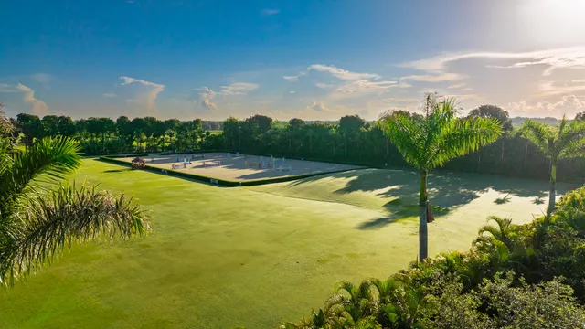 a view of a patio with a dining table and chairs