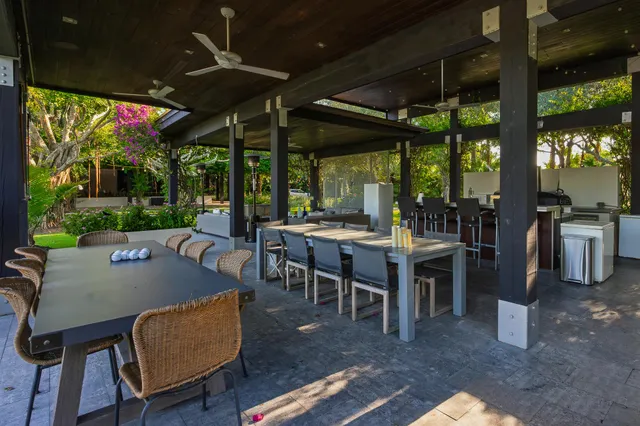 a view of a patio with couches and potted plants