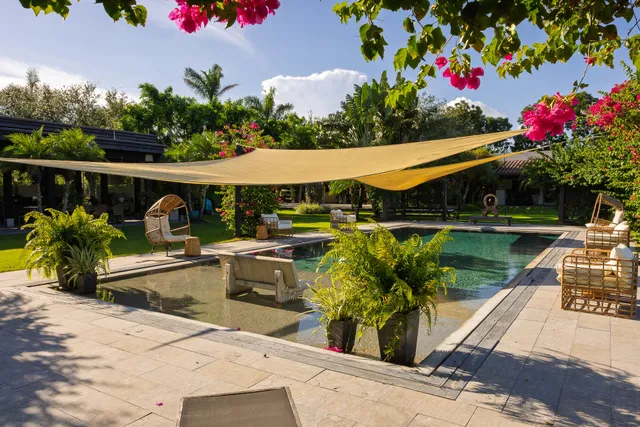 an aerial view of a house with garden space and street view