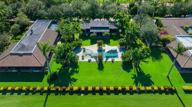 a view of a back yard of the house and a garden
