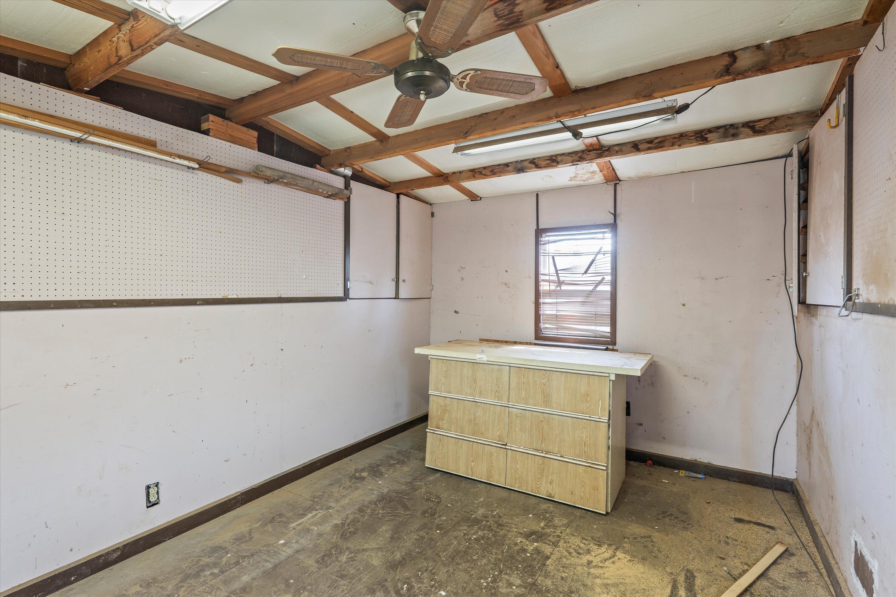 4520 54th Street Lubbock, TX 79414 - Photo 30 of 32 a view of storage and utility room with a window