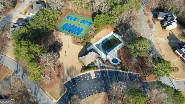 an aerial view of a house swimming pool and outdoor space