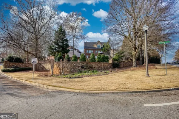 a house with trees in the background
