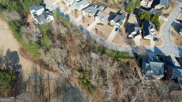a aerial view of a house with a yard