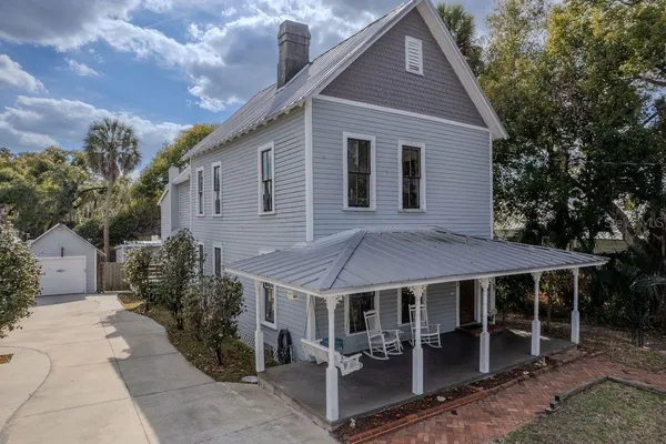 a view of a house with a yard