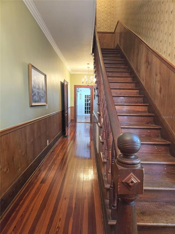 720 Southeast 3rd Street Ocala, FL 34471 - Photo 15 of 82 a view of entryway and hall with wooden floor