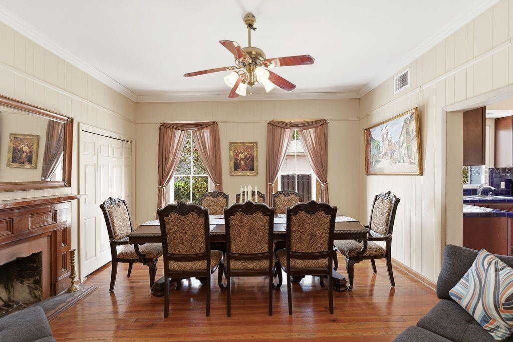 720 Southeast 3rd Street Ocala, FL 34471 - Photo 21 of 82 a view of a dining room with furniture wooden floor and chandelier