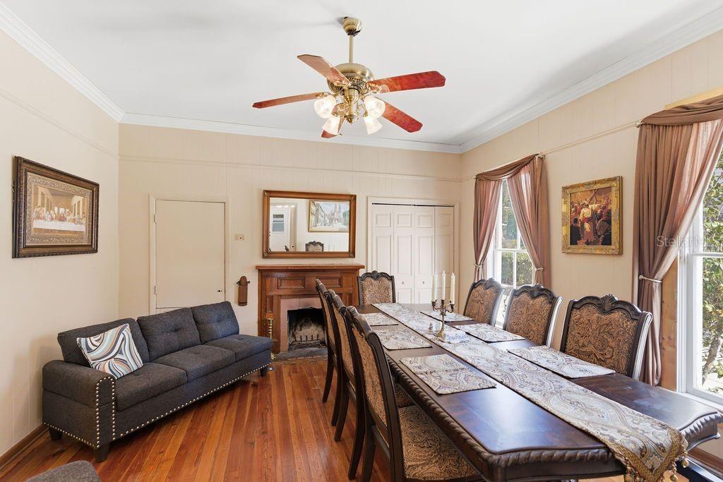 720 Southeast 3rd Street Ocala, FL 34471 - Photo 22 of 82 a living room with furniture a dining table and a ceiling fan