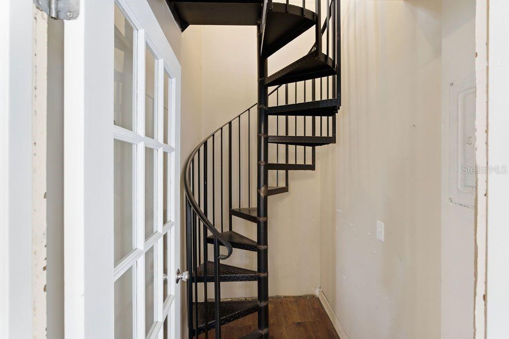 720 Southeast 3rd Street Ocala, FL 34471 - Photo 30 of 82 a view of staircase with lots of frames on wall and a window