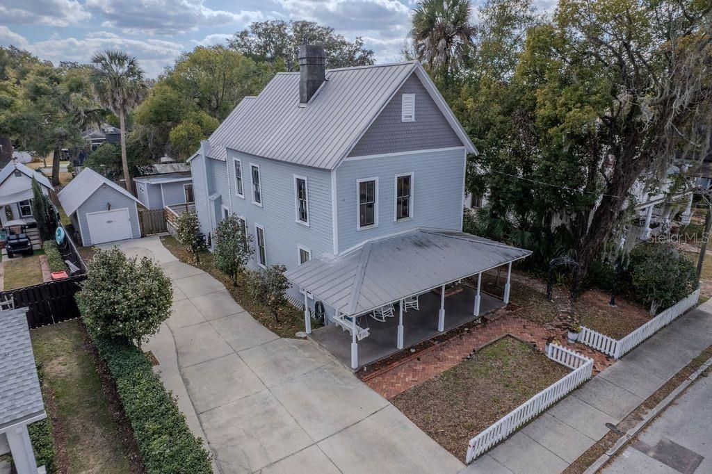 720 Southeast 3rd Street Ocala, FL 34471 - Photo 3 of 82 an aerial view of a house with a yard