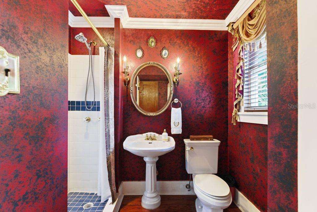 720 Southeast 3rd Street Ocala, FL 34471 - Photo 31 of 82 a bathroom with a toilet a sink and a mirror