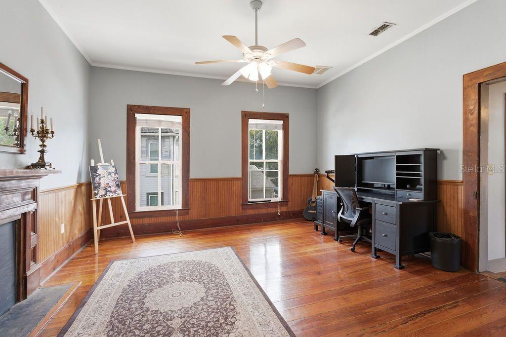 720 Southeast 3rd Street Ocala, FL 34471 - Photo 41 of 82 a living room with furniture and a flat screen tv