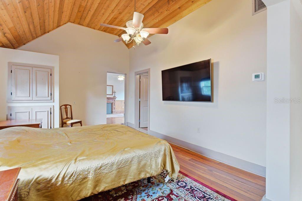 720 Southeast 3rd Street Ocala, FL 34471 - Photo 42 of 82 a bedroom with a bed and a flat screen tv