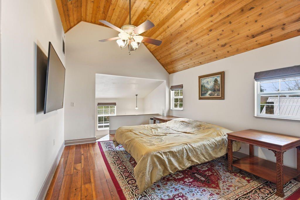720 Southeast 3rd Street Ocala, FL 34471 - Photo 44 of 82 a bed sitting in a spacious bedroom next to a window