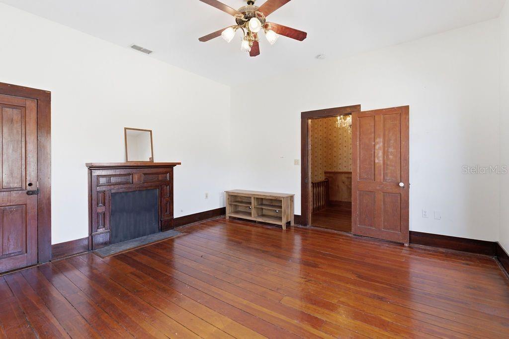 720 Southeast 3rd Street Ocala, FL 34471 - Photo 53 of 82 a view of an empty room with wooden floor and a window