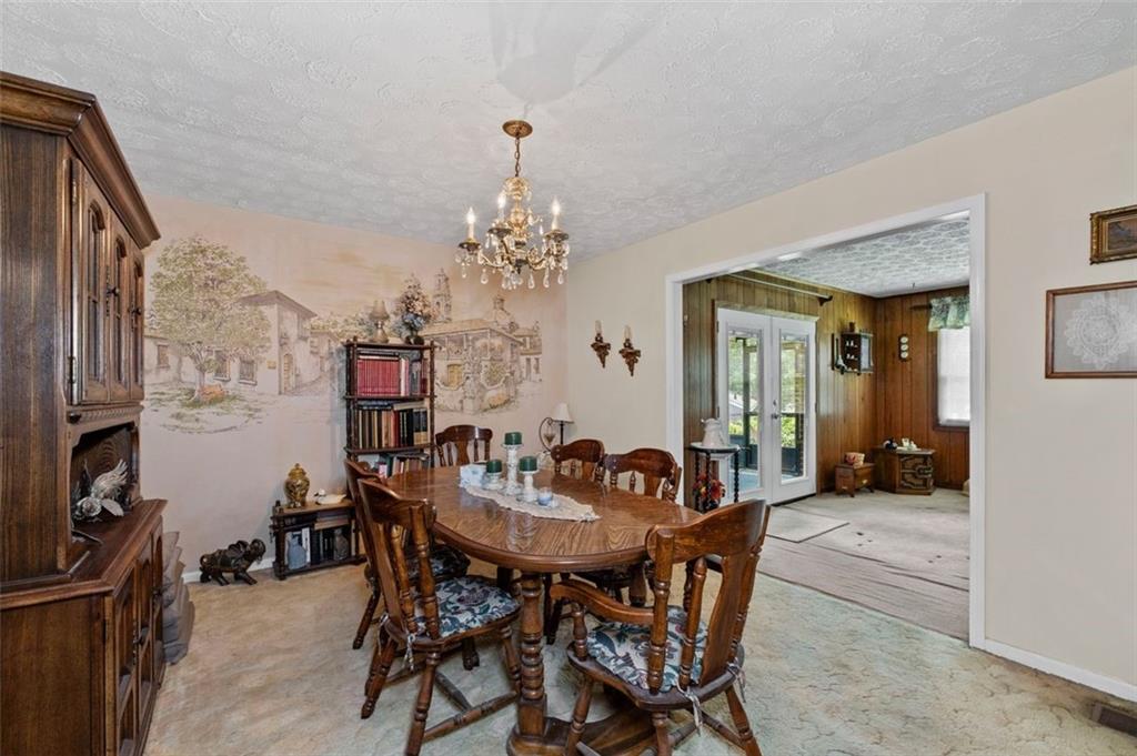 2880 Sherwood Road Southeast Smyrna, GA 30082 - Photo 11 of 33 a view of a dining room with furniture and chandelier
