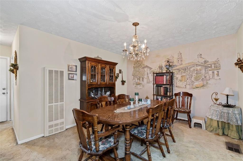 2880 Sherwood Road Southeast Smyrna, GA 30082 - Photo 12 of 33 a view of a dining room with furniture and chandelier