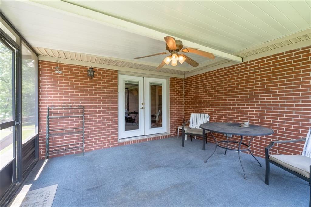 2880 Sherwood Road Southeast Smyrna, GA 30082 - Photo 29 of 33 a view of a patio with a table and chairs