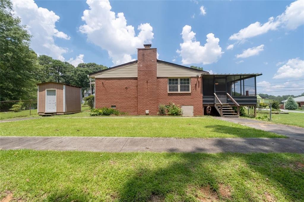 2880 Sherwood Road Southeast Smyrna, GA 30082 - Photo 33 of 33 a front view of a house with garden