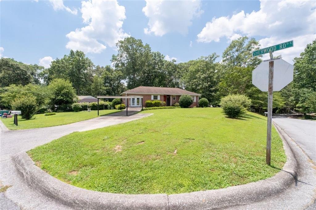 2880 Sherwood Road Southeast Smyrna, GA 30082 - Photo 4 of 33 a view of a swimming pool with a patio