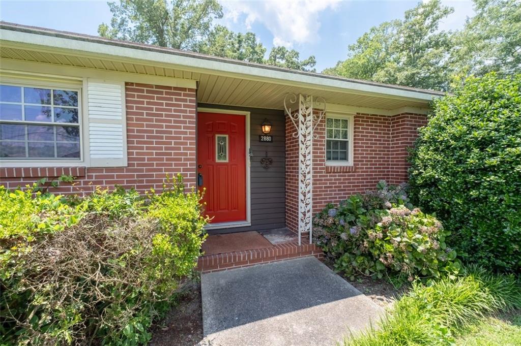 2880 Sherwood Road Southeast Smyrna, GA 30082 - Photo 7 of 33 a front view of a house with plants